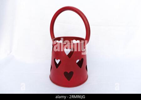 red pot with hearts and handle Stock Photo