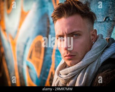 A man with a scarf around his neck Stock Photo