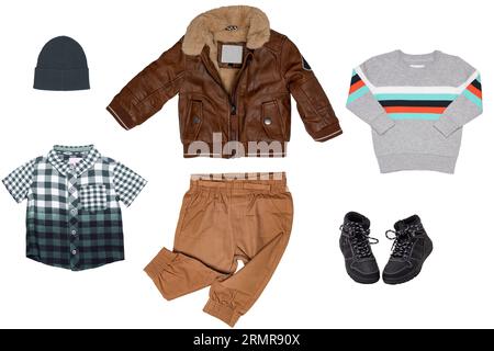 Collage set of little boys autumn clothes isolated. Denim trousers or pants, boots, sneaker, leather jacket, shirts and a cap for child boy. Children' Stock Photo