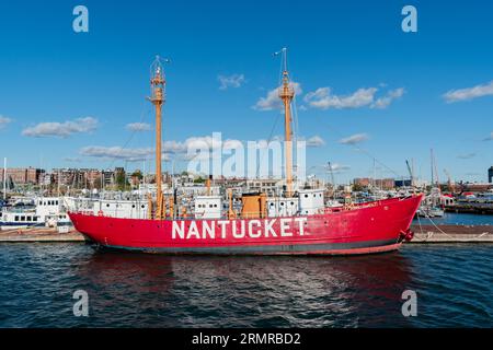 Nantucket Lightship No. 112 - or LV-12, now designated a National Historic Landmark, moored at the Boston Harbour Shipyard  Marina on a sunny fall day. Stock Photo