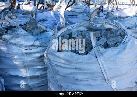 Plastic bags with paving stones Stock Photo