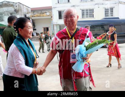 (140725) -- LAIZA, July 25, 2014 (Xinhua) -- Chairman of Kayin National Union (KNU) Gen. Saw Mutu Say Poe (R), leader of the 16-member Leading Committee for the third ethnic summit, arrives to attend the third Myanmar ethnic summit in Laiza, northernmost Kachin state, Myanmar, July 25, 2014. The third Myanmar ethnic summit kicked off in Laiza, northernmost Kachin state, Friday to finalize their second draft of nationwide ceasefire agreement, local reports reaching here said. (Xinhua/Manaw Htun) MYANMAR-KACHIN STATE-LAIZA-ETHNIC SUMMIT PUBLICATIONxNOTxINxCHN   July 25 2014 XINHUA Chairman of  N Stock Photo