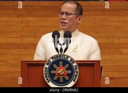 (140728) -- MANILA, July 28, 2014 (Xinhua) -- Philippine President Benigno Aquino III delivers his fifth State of the Nation Address (SONA) during the joint session of the 16th Congress at the Batasang Pambansa in Quezon City, the Philippines, July 28, 2014. Philippine President Benigno Aquino III on Monday detailed his government s achievements in his SONA following the filing of three impeachment complaints against him. (Xinhua) PHILIPPINES-PRESIDENT-SONA PUBLICATIONxNOTxINxCHN   Manila July 28 2014 XINHUA Philippine President Benigno Aquino III delivers His Fifth State of The Nation Address Stock Photo