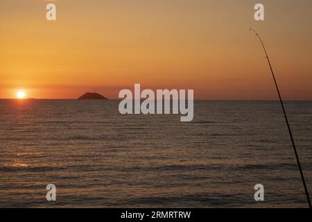 sunset over the aeolian islands seen from calabria Stock Photo