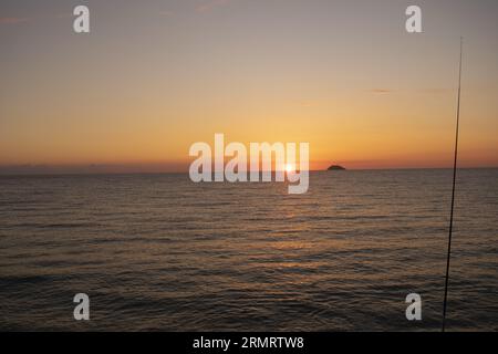 sunset over the aeolian islands seen from calabria Stock Photo