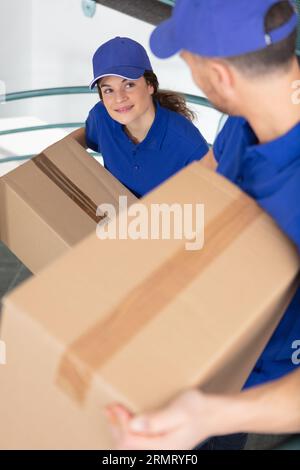 young male and female movers Stock Photo