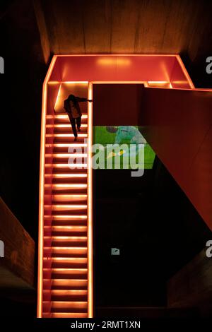 (230830) -- FRANKFURT, Aug. 30, 2023 (Xinhua) -- A tourist visits the Ruhr Museum at the Zollverein coal mine industrial complex in Essen, Germany, Aug. 16, 2023.  From the Ruhr area in Germany to the Shougang industrial park in Beijing, one after another steel 'giants' stand as witnesses to the development process of human civilization.     The Ruhr area in Germany is a significant industrial zone in Europe, once a coal and steel production hub for Germany. The Zollverein coal mine industrial complex in Essen was one of the world's largest coal mines from the late 19th to the early 20th centu Stock Photo