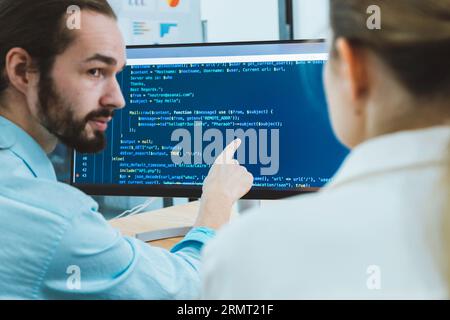 Professional development programers programming game software or developing code for shopping online financial data security system network working at Stock Photo
