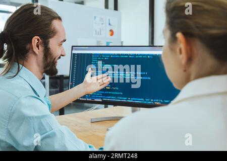 Professional development programers programming game software or developing code for shopping online financial data security system network working at Stock Photo