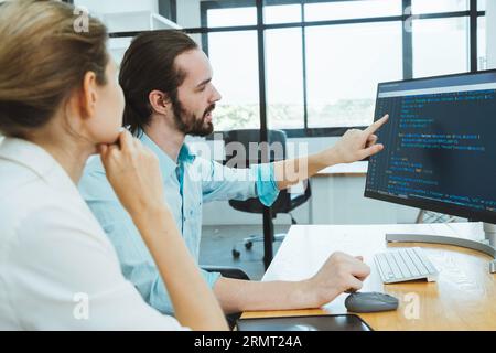 Professional development programers programming game software or developing code for shopping online financial data security system network working at Stock Photo