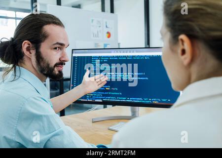 Professional development programers programming game software or developing code for shopping online financial data security system network working at Stock Photo