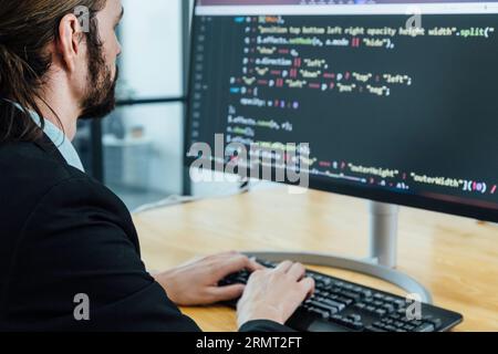 Professional development programer programming game software or developing code for shopping online financial data security system network working at Stock Photo
