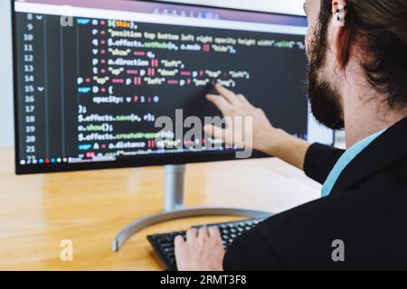 Professional development programer programming game software or developing code for shopping online financial data security system network working at Stock Photo