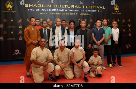 (140820) -- LONDON, Aug. 20, 2014 -- Founder of Shaolin Temple UK, master Shi Yanzi (3rd L, 2nd Row) and Dr. Ding Ding (2nd L, 2nd Row), general secretary of Shaolin Europe Association, pose for a group photo during the press conference for the third Shaolin Cultural Festival held in Shaolin Temple UK in London, Britain on Aug. 20, 2014. The third Shaolin Cultural Festival will be held in London from Oct. 8 to Oct. 14, 2014. ) BRITAIN-LONDON-SHAOLIN CULTURAL FESTIVAL-PRESS CONFERENCE HanxYan PUBLICATIONxNOTxINxCHN   London Aug 20 2014 Founder of Shaolin Temple UK Master Shi Yanzi 3rd l 2nd Row Stock Photo