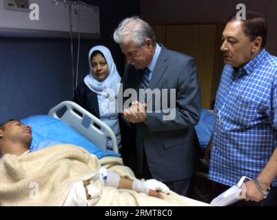 (140822) -- CAIRO, Aug. 22, 2014 -- South Sinai Governor Khaled Fouda (C) visits an injured person at a hospital in Egypt s South Sinai province, Aug. 22, 2014. At least 33 people were killed and over 40 others seriously wounded in the early hours of Friday as two buses collided on a highway some 50 km away from Red Sea resort city Sharm El-Sheikh in Egypt s South Sinai province, a security source told Xinhua. ) EGYPT-CAIRO-SINA-ACCIDENT STR PUBLICATIONxNOTxINxCHN   Cairo Aug 22 2014 South Sinai Governor Khaled Fouda C visits to Injured Person AT a Hospital in Egypt S South Sinai Province Aug Stock Photo