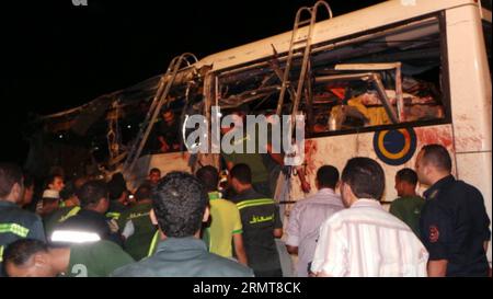 (140822) -- CAIRO, Aug. 22, 2014 -- People gather at the site of a bus crash in Egypt s South Sinai province, Aug. 22, 2014. At least 33 people were killed and over 40 others seriously wounded in the early hours of Friday as two buses collided on a highway some 50 km away from Red Sea resort city Sharm El-Sheikh in Egypt s South Sinai province, a security source told Xinhua. ) EGYPT-CAIRO-SINA-ACCIDENT STR PUBLICATIONxNOTxINxCHN   Cairo Aug 22 2014 Celebrities gather AT The Site of a Bus Crash in Egypt S South Sinai Province Aug 22 2014 AT least 33 Celebrities Were KILLED and Over 40 Others SE Stock Photo