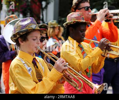 LONDON, Aug. 24, 2014 -- Performers parade through the streets during the Notting Hill Carnival in London, Britain, on August 24, 2014. The Notting Hill Carnival is the largest street festival in Europe and was first held in 1964 by the Afro-Caribbean community. Over the bank holiday weekend, the streets come alive to bands, colourful floats and costumed performers as members of the public flood into the area to join the celebrations. ) UK-LONDON-NOTTING HILL CARNIVAL-CHILDREN S DAY PARADE HanxYan PUBLICATIONxNOTxINxCHN   London Aug 24 2014 Performers Parade Through The Streets during The Nott Stock Photo