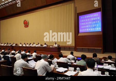 (140825) -- BEIJING, Aug. 25, 2014 -- China s lawmakers discuss whether to revise election methods for Hong Kong s chief executive and legislature at the 10th meeting of the 12th National People s Congress (NPC) Standing Committee in Beijing, China, Aug. 25, 2014. Zhang Dejiang, chairman of the NPC Standing Committee, presided over the meeting. ) (hdt) (FOCUS) CHINA-BEIJING-NPC-MEETING (CN) LiuxWeibing PUBLICATIONxNOTxINxCHN   Beijing Aug 25 2014 China S lawmakers discuss whether to revise ELECTION methods for Hong Kong S Chief Executive and Legislature AT The 10th Meeting of The 12th National Stock Photo