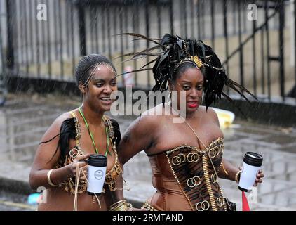 (140825) -- LONDON, Aug. 25, 2014 -- Performers prepare for the parade during the Notting Hill Carnival in London, Britain, on Aug. 25, 2014. Over 1 million visitors are expected to attend the two-day event which is the largest of its kind in Europe. The event has taken place on the West London streets every August Bank Holiday weekend since 1964. ) BRITAIN-LONDON-NOTTING HILL CARNIVAL HanxYan PUBLICATIONxNOTxINxCHN   London Aug 25 2014 Performers prepare for The Parade during The Notting Hill Carnival in London Britain ON Aug 25 2014 Over 1 Million Visitors are expected to attend The Two Day Stock Photo