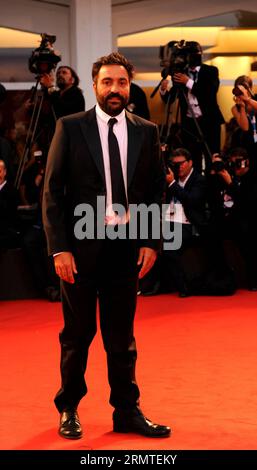 (140831) -- VENICE, Aug. 31, 2014 -- Director Saverio Costanzo poses on the red carpet for Hungry Hearts which is selected for the main competition during the 71th Venice Film Festival, in Lido of Venice, Italy on Aug. 31, 2014. ) ITALY-VENICE-FILM FESTIVAL-HUNGRY HEARTS XuxNizhi PUBLICATIONxNOTxINxCHN   Venice Aug 31 2014 Director Saverio Costanzo Poses ON The Red Carpet for Hungry Hearts Which IS Selected for The Main Competition during The 71th Venice Film Festival in Lido of Venice Italy ON Aug 31 2014 Italy Venice Film Festival Hungry Hearts  PUBLICATIONxNOTxINxCHN Stock Photo