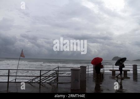 People look the high waves caused by hurricane Norbert , in the boardwalk of Mazatlan Port, in Sinaloa State, northwest Mexico, on Sept. 4, 2014. Hurricane Norbert will continue causing heavy rains in northwest and western Mexico, although it has not landed the country, the National Weather Service reported. ) (jg) (fnc) MEXICO-MAZATLAN-ENVIRONEMENT-HURRICANE-NORBERT JuanxPerez PUBLICATIONxNOTxINxCHN   Celebrities Look The High Waves CAUSED by Hurricane Norbert in The Boardwalk of Mazatlan Port in Sinaloa State Northwest Mexico ON Sept 4 2014 Hurricane Norbert will continue causing Heavy Rains Stock Photo