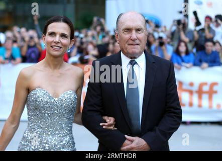 Actor Robert Duvall and his wife Luciana Pedraza arrive for the premiere of the opening film The Judge at Roy Thomson Hall during the 39th Toronto International Film Festival in Toronto, Canada, Sept. 4, 2014. Kicked off on Thursday, this 11-day event delivers 406 films from over 80 countries and regions this year. ) CANADA-TORONTO-INTERNATIONAL FILM FESTIVAL ZouxZheng PUBLICATIONxNOTxINxCHN   Actor Robert DuVall and His wife Luciana Pedraza Arrive for The Premiere of The Opening Film The Judge AT Roy Thomson Hall during The 39th Toronto International Film Festival in Toronto Canada Sept 4 201 Stock Photo