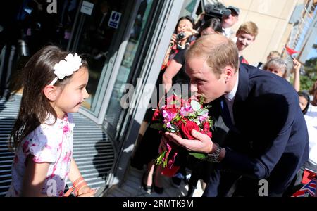 Prince William (R), Duke of Cambridge, receives flowers for his wife Catherine, Duchess of Cambridge, from Malaviika Mitter (L) as he arrives to formally inaugurate the Dickson Poon University of Oxford China Centre Building in Oxford, the United Kingdom, on Sept. 8, 2014. Prince William unveiled the Dickson Poon University of Oxford China Centre here on Monday. ) UK-OXFORD-CHINA CENTRE-PRINCE-WILLIAM-UNVEILING HanxYan PUBLICATIONxNOTxINxCHN   Prince William r Duke of Cambridge receives Flowers for His wife Catherine Duchess of Cambridge from  Mitter l As he arrives to formally inaugurate The Stock Photo