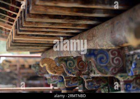 (140912) -- XIAHE, Sept. 12, 2014 -- Photo taken on Sept. 2, 2014 shows wooden architectural parts inside the residence of the first Jamyang Shepa, founder of the Labrang Monastery, in Xiahe County of Gannan Tibetan Autonomous Prefecture in northwest China s Gansu Province. The Labrang Monastery, a major Tibetan Buddhism monastery in China, is undergoing the largest renovation programme since its establishment in 1709. The renovation, which started in April 2013, is intended to replace stone and wooden structures within the monastery that had been worn down by the years. The Labrang Monastery Stock Photo
