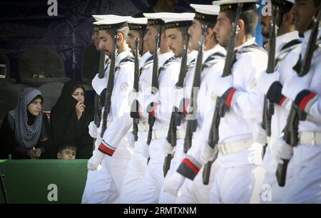 (140922) -- TEHRAN, Sept. 22, 2014 -- People watch a military parade marking the 34th anniversary of the beginning of the 1980-1988 Iran-Iraq war in Tehran, capital of Iran, on Sept. 22, 2014. ) IRAN-TEHRAN-MILITARY PARADE AhmadxHalabisaz PUBLICATIONxNOTxINxCHN   TEHRAN Sept 22 2014 Celebrities Watch a Military Parade marking The 34th Anniversary of The BEGINNING of The 1980 1988 Iran Iraq was in TEHRAN Capital of Iran ON Sept 22 2014 Iran TEHRAN Military Parade AhmadxHalabisaz PUBLICATIONxNOTxINxCHN Stock Photo