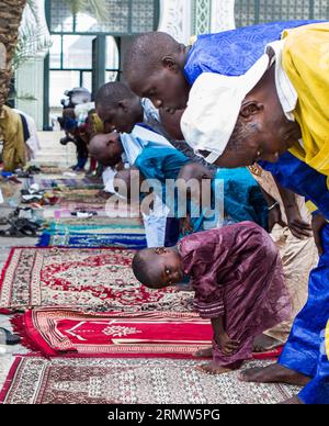 Senegalese men pray during the Eid al-Adha festival at the Grand Mosque in Dakar, Senegal, Oct. 5, 2014.) SENEGAL-DAKAR-EID AL-ADHA-CELEBRATION LixJing PUBLICATIONxNOTxINxCHN   Senegalese Men Pray during The Oath Al Adha Festival AT The Grand Mosque in Dakar Senegal OCT 5 2014 Senegal Dakar Oath Al Adha Celebration  PUBLICATIONxNOTxINxCHN Stock Photo