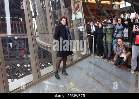 (141006) -- PARIS, Oct. 6, 2014 -- Paris mayor Anne Hidalgo (L) poses on the new glass floor at the Eiffel Tower in Paris, France, on Oct. 6, 2014. With a spectacular glass floor, solar panels and modernized pavilions offering pristine panoramic view to handicapped visitors, first floor of France s iconic tower Tour Eiffel appeared with a fresh look to its millions of fans. ) FRANCE-PARIS-EIFFEL TOWER YingxQiang PUBLICATIONxNOTxINxCHN   Paris OCT 6 2014 Paris Mayor Anne Hidalgo l Poses ON The New Glass Floor AT The Eiffel Tower in Paris France ON OCT 6 2014 With a Spectacular Glass Floor Solar Stock Photo