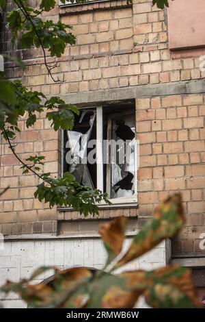 Missile attack in Kyiv, Ukraine, august 2023. Broken windows after explosion. House damaged by blast wave. War in Ukraine. Stock Photo