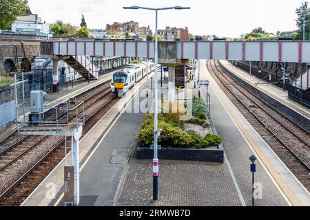 A Thameslink train approaching the platform at Kentish Town overground railway station, London, UK Stock Photo