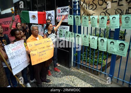 (141023) -- RIO DE JANEIRO, Oct. 22, 2014 -- People take part in a protest in front of the General Consulate of Mexico in protest for the disappearance of 43 students from the Ayotzinapa teachers training college, in Rio de Janeiro, Brazil, on Oct. 22, 2014. Renowned intellectuals from around the world have joined an international outcry, demanding justice in the case of 43 students missing since late September in Mexico, local media reported Wednesday. Adriano Ishibashi/Frame/AGENCIA ESTADO) (ce) (lmz) BRAZIL-RIO DE JANEIRO-MEXICO-SOCIETY-DEMONSTRATION e AE PUBLICATIONxNOTxINxCHN   Rio de Jan Stock Photo