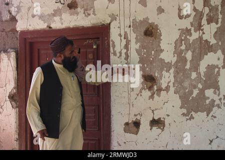 (230830) -- BEIJING, Aug. 30, 2023 (Xinhua) -- A man shows the damage of a house destroyed by bombs dropped by U.S. forces in Hesarak District of Nangarhar Province, Afghanistan, July 30, 2023. (Photo by Aimal Zahir/Xinhua) Stock Photo
