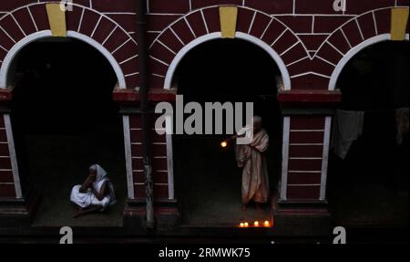 (141102) -- BHUBANESWAR, Nov. 1, 2014 -- Indian Hindus offer evening rituals inside a rest house for devotees on the outskirt of the Lingaraj temple in the eastern Indian state Orissa s capital city Bhubaneswar, India, Nov. 1, 2014. The five-day-long Panchuka festival starts here on Nov. 1. ) INDIA-BHUBANESWAR-PANCHUKA FESTIVAL Stringer PUBLICATIONxNOTxINxCHN   Bhubaneswar Nov 1 2014 Indian Hindus OFFER evening Ritual Inside a Rest House for devotees ON The outskirts of The Lingaraj Temple in The Eastern Indian State Orissa S Capital City Bhubaneswar India Nov 1 2014 The Five Day Long  Festiva Stock Photo