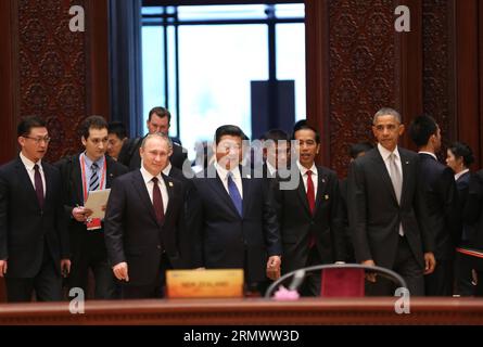 (141111) -- BEIJING, Nov. 11, 2014 -- Chinese President Xi Jinping (front C), U.S. President Barack Obama (1st R, front), Indonesian President Joko Widodo (2nd R, front), Russian President Vladimir Putin (front L) and other leaders and representatives from the Asia-Pacific Economic Cooperation (APEC) member economies arrive at the venue for the 22nd APEC Economic Leaders Meeting at the Yanqi Lake International Convention Center in the northern suburb of Beijing, capital of China, Nov. 11, 2014. Lan Hongguang) (hdt) (APEC 2014) CHINA-BEIJING-APEC-ECONOMIC LEADERS MEETING (CN) LanxHonggguang PUB Stock Photo