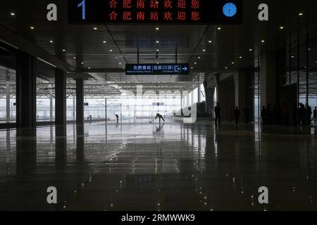200112) -- HEFEI, Jan. 12, 2020 (Xinhua) -- Train crew members Diao Yuting,  Li Xinyan and Wang Yuxin (from L to R) attend a morning meeting at the  Hefei South Railway Station