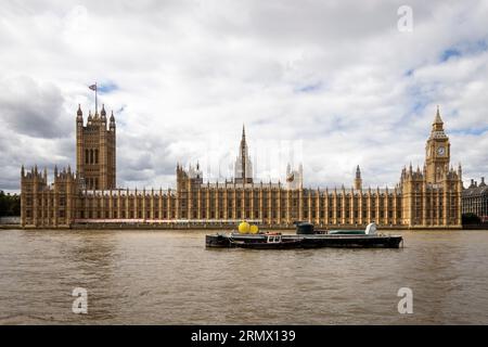 The Palace of Westminster functions as the gathering location for both the House of Commons and the House of Lords, the dual chambers of the UK Parlia Stock Photo