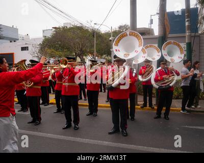 Lima, Peru - July 29 2023: Peruvian Nen Playing Wind Instruments, Trumpets and Tubas, Preparing for the Peruvian Independence Day Parade Stock Photo