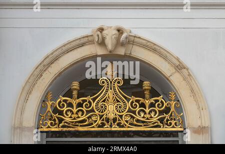 ornate metal work  and rams head entrance to the library in Saffron Walden, Essex, England, UK Stock Photo