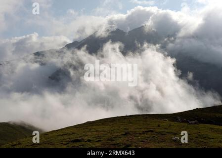 The eastern massif of the Picos de Europa, northern Spain, from the Puertos de Aliva, near the Hotel Aliva, with cloud hiding the lower slopes. Stock Photo
