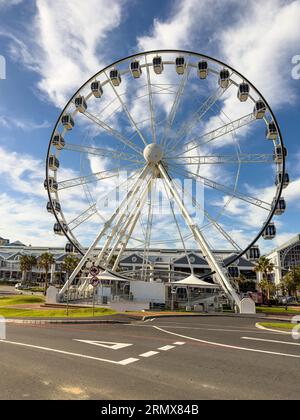 The Cape Wheel is a 40 meter observation wheel featuring 30 enclosed cabins with sweeping views of Granger Bay, Robben Island and Table Mountain Stock Photo