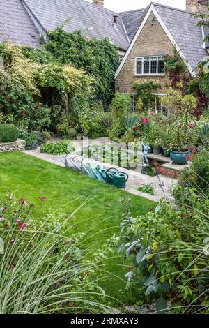 watering-cans-and-lawn-in-secluded-garden-of-18th-century-georgian