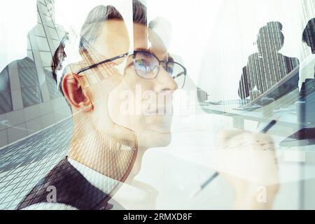 Team of professional architects plans a new modern building Stock Photo