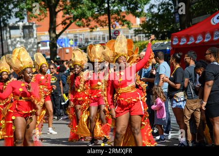 London, UK, 27th August 2023. It's the first day of the Notting Hill Carnival, and its Children's Day. Lots of costumes and thousands of revellers on the streets of Notting Hill, London, Andrew Lalchan Photography/Alamy Live News Stock Photo