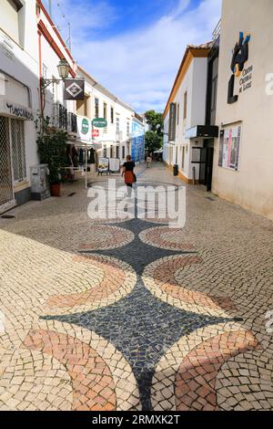 Lagos, Portugal- October 20, 2022: Narrow Cobblestone streets and typical Portuguese facades in Lagos city, Portugal Stock Photo