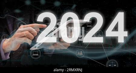 2024 numbers. Business person work on phone Stock Photo