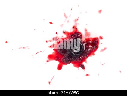 Smashed black currant berries isolated on white background Stock Photo