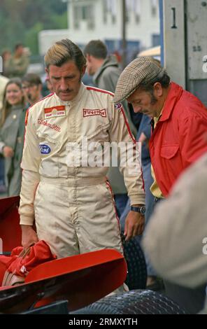 Graham Hill and Colin Chapman in the pits at the1969 United States Formula 1 Grand Prix at the Watkins Glen Race Course in Watkins Glen New York on October 3-5, 1969 Stock Photo